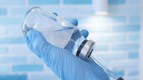 Drawing Clear Liquid from Vial with Syringe