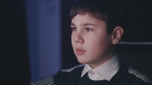 1213 Year Old Boy Uses Computer at Night Home