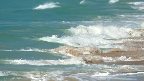 Ocean Waves Crashing on Sandy Beach Shoreline