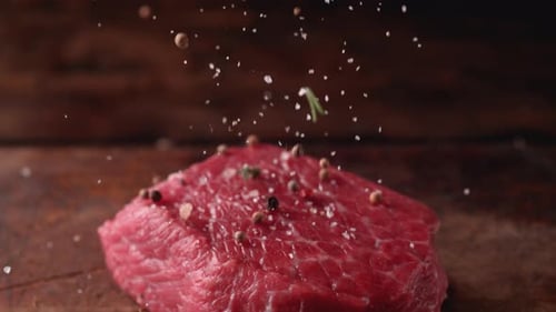 Raw Beef Seasoned with Salt, Pepper, and Rosemary