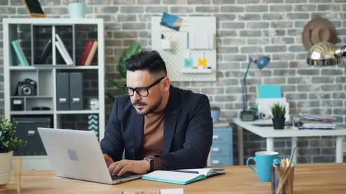 Man Working at Desk in Modern Office