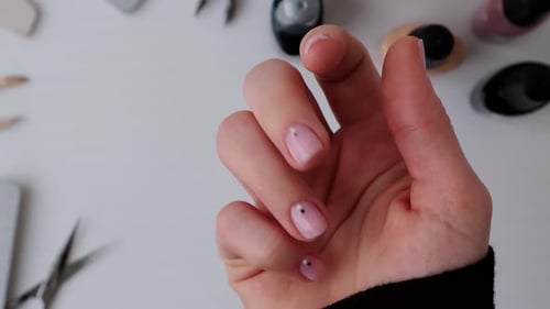 Close up of Hand with Pink Manicured Nails