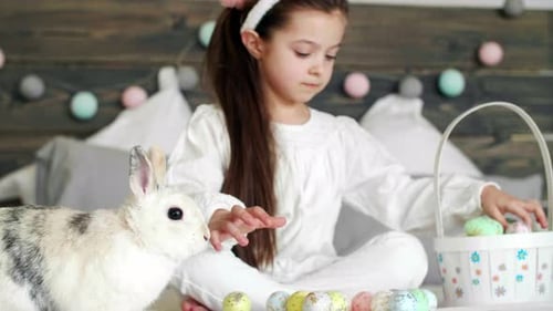 Girl with Rabbit and Easter Egg Basket