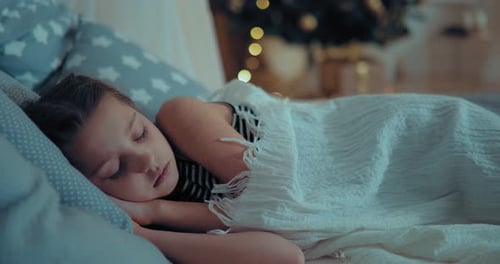 Girl Sleeping Peacefully on Christmas Eve