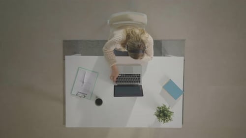 Woman Working at Desk from Overhead View
