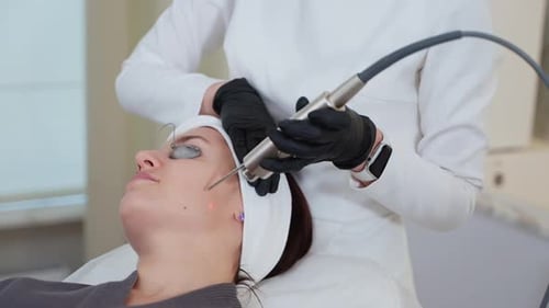 Using YAG Laser for Facial Skin Therapy at Cosmetology Clinic