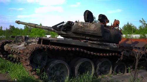 Side View Burnt Tank Outdoors on Sunny Summer Day