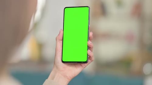 Woman Using Smartphone with Green Screen Chroma Screen