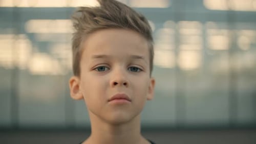 Boy's Serious Close Up in Urban Setting