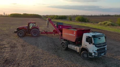 Drone Footage of the Agricultural Work in the Field Truck and Tractor