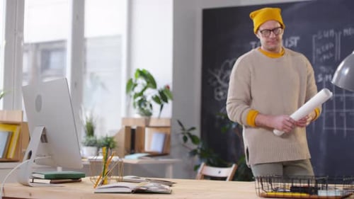 Creative Man Working on Project in Office