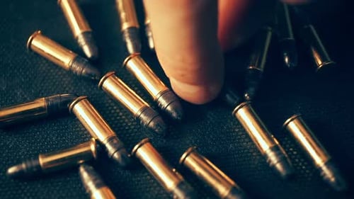 Close Up of Bullets with Hand