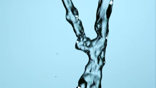 Water pouring and splashing in ultra slow motion 1500fps on a reflective surface - WATER POURS
