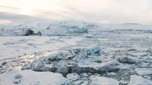 Aerial View of the J Kuls Rl n Glacial Lagoon and Floating Icebergs. The Beginning of Spring in