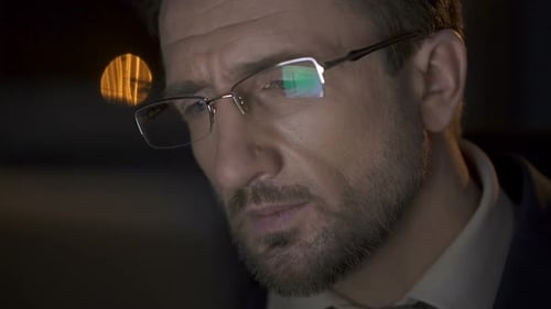 Man Wearing Glasses Looking at Computer Screen