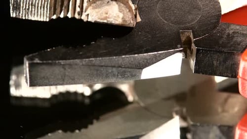 Close Up Pliers Cutting Thin Wire