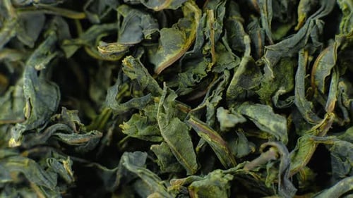 Closeup Dried Green Tea Leaves Rotating 360 Top View