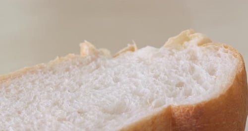 Hand touch the white bread