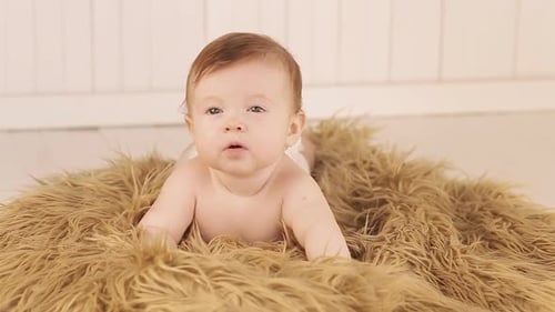 Adorable Baby Smiling on Furry Blanket Indoors