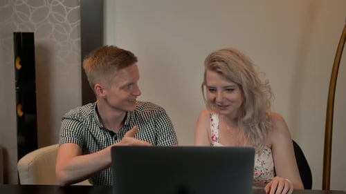 Couple Using Laptop Computer Together at Home
