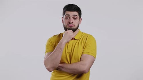 Portrait of Hesitant Man on White Background