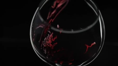 Red Wine Pouring into Wine Glass