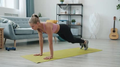 Fit Woman Doing Mountain Climber Exercise at Home
