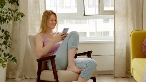 Woman Using Smartphone Casually in Cozy Room