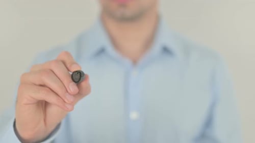Man Writing Outsourcing Concept on Transparent Surface