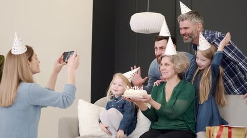 Happy Family Celebrates Birthday With Cake Indoors