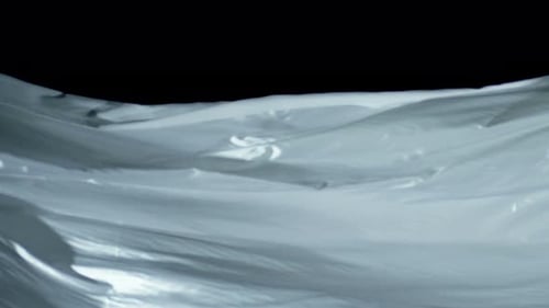 Undulating White Fabric on Black Background