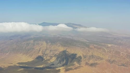 Beautiful Drone Flight Above the Clouds Over the Mountain