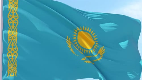 Realistic Waving Flag of Kazakhstan Against Blue Sky
