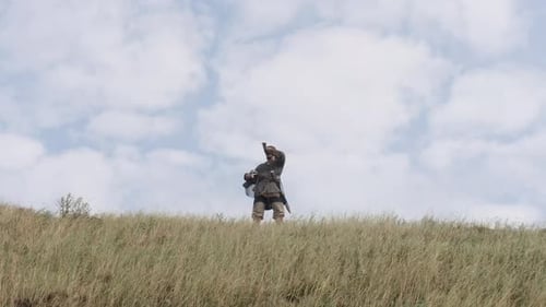 Medieval Soldiers Rallying on a Grassy Hilltop