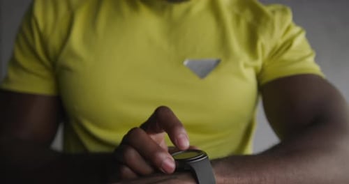 Man Using Smartwatch in Close Up Indoor Shot