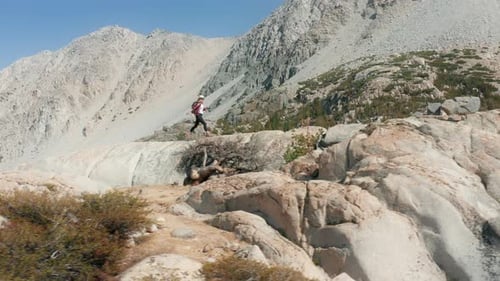 Young Adult Celebrating a Mountain Hiking Adventure
