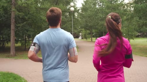 Couple Jogging in Park