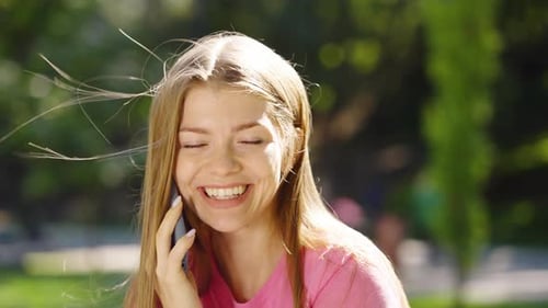 Blonde Woman Talking on Phone and Laughing