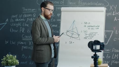 Bearded Teacher Explains Math Lesson to Camera