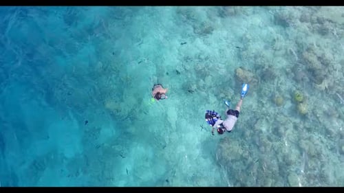 Two lovers in love on tropical sea view beach holiday by turquoise lagoon with bright sandy backgrou