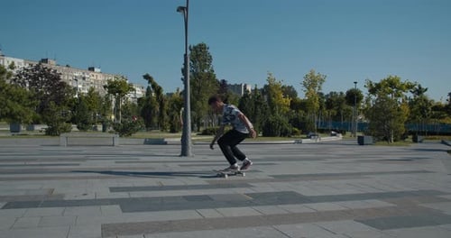 Amazing Kickflip Performed By a Skater Boy at the Skatepark,