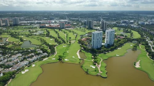 Aerial View on the Miami Suburban Area with the Private Golf Course and Lake