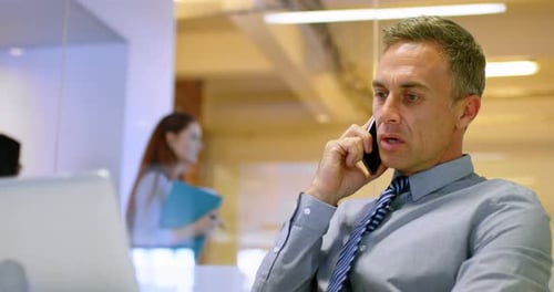 Businessman talking on mobile phone 4k