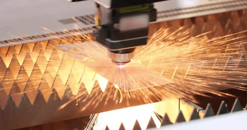 Laser Cutter Precisely Cuts Metal Sheet in Factory