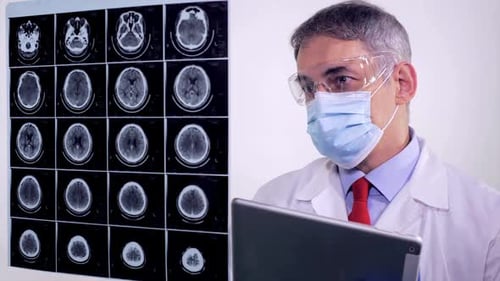 Doctor Neurologist Analyzing An Mri