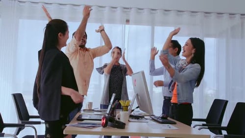 Successful Business People Celebrating Project Success at Office