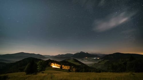 Night Time Lapse of Mountains and Stars