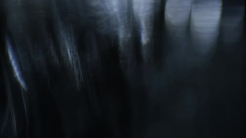 Moving Blurred Lights Bokeh Effect on Dark Background