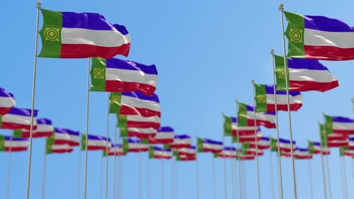 Multiple Waving National Flags Against a Clear Blue Sky
