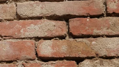 Red ancient wall with red clays and cement for backgrounds 4K 2160p 30fps UltraHD titlting video - S